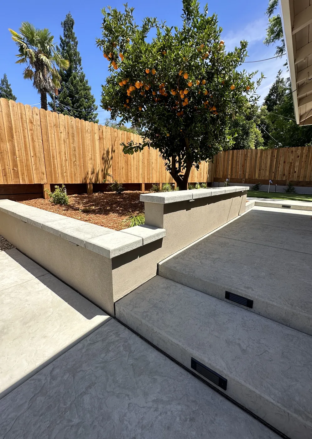 New concrete patio and walkway poured by CJR at a Carmichael home