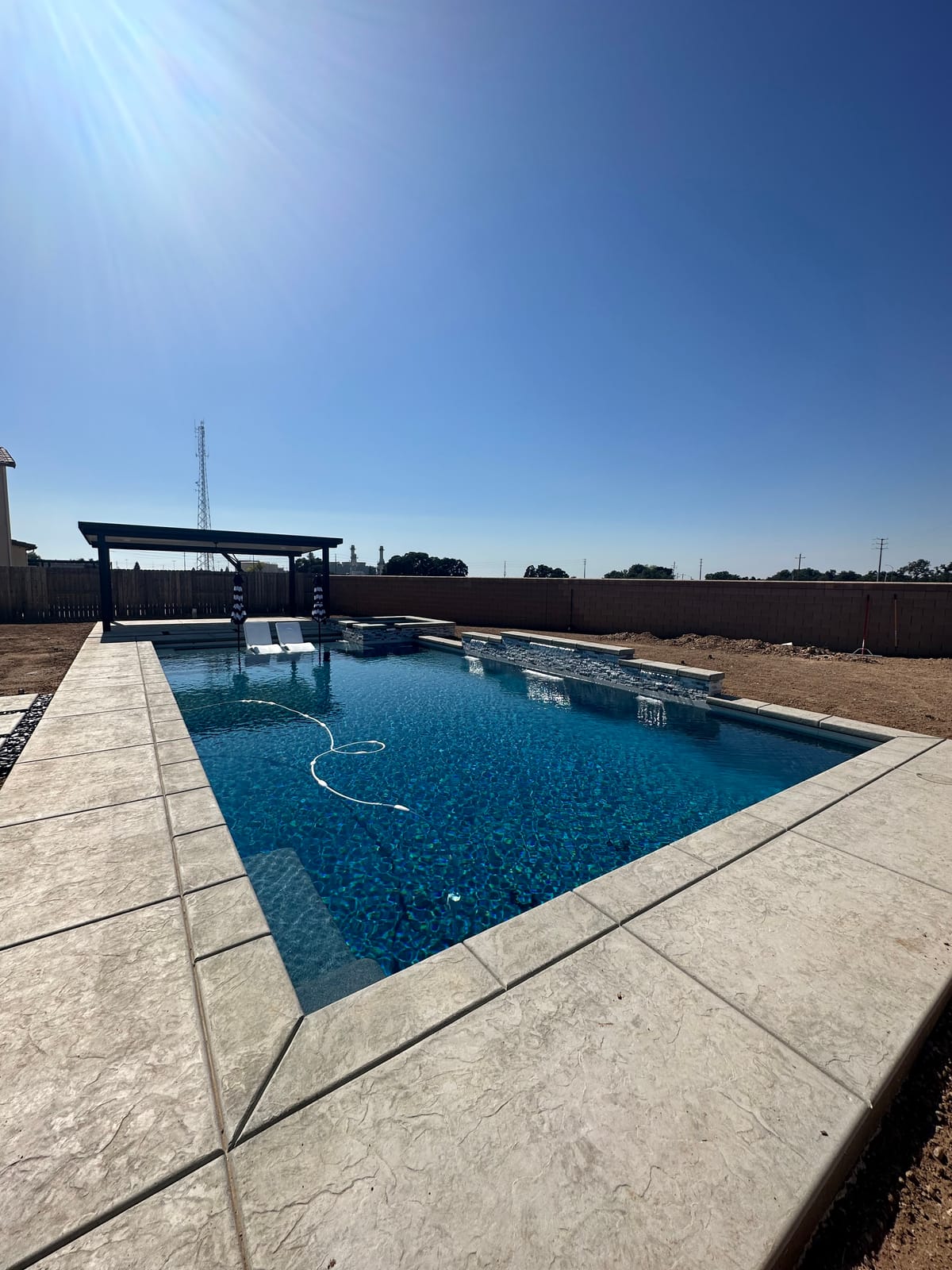 Custom CJR pool with raised spa and water feature