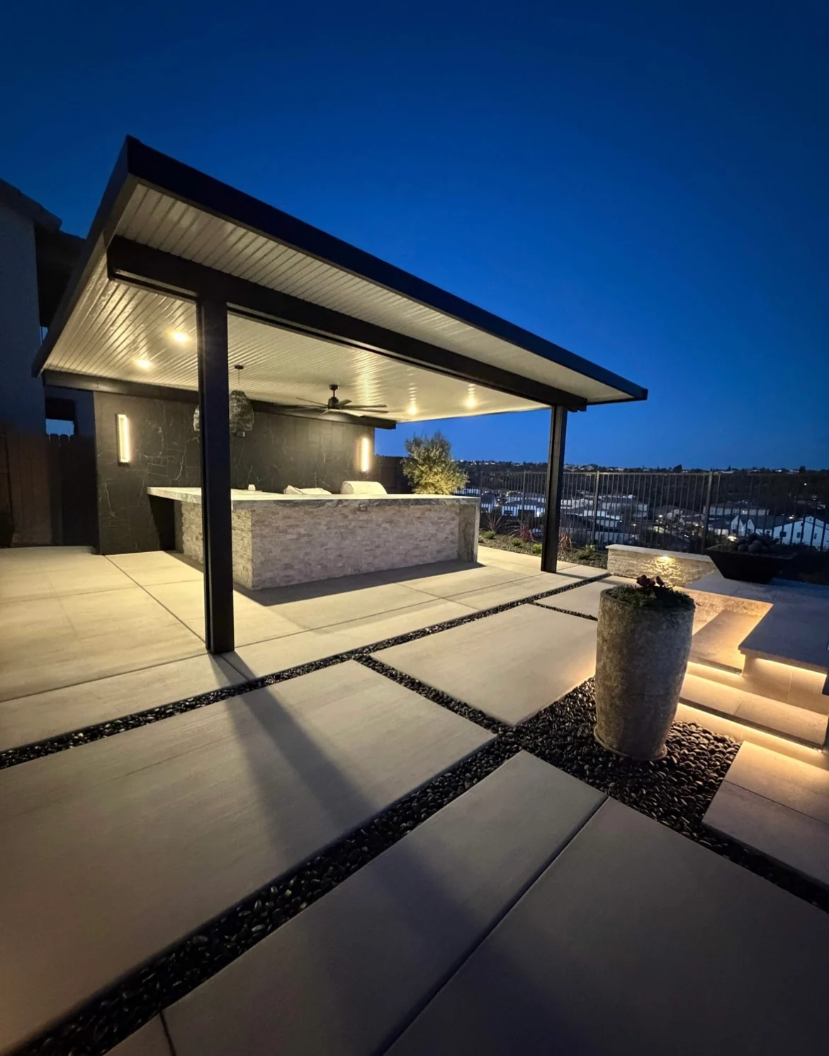 Covered outdoor kitchen project by CJR Concrete & Landscape Construction