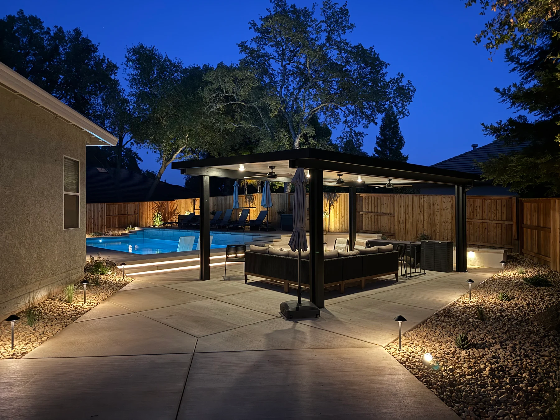 Outdoor seating and lighting project by CJR Concrete & Landscape Construction